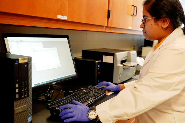 A student using data analysis equipment
