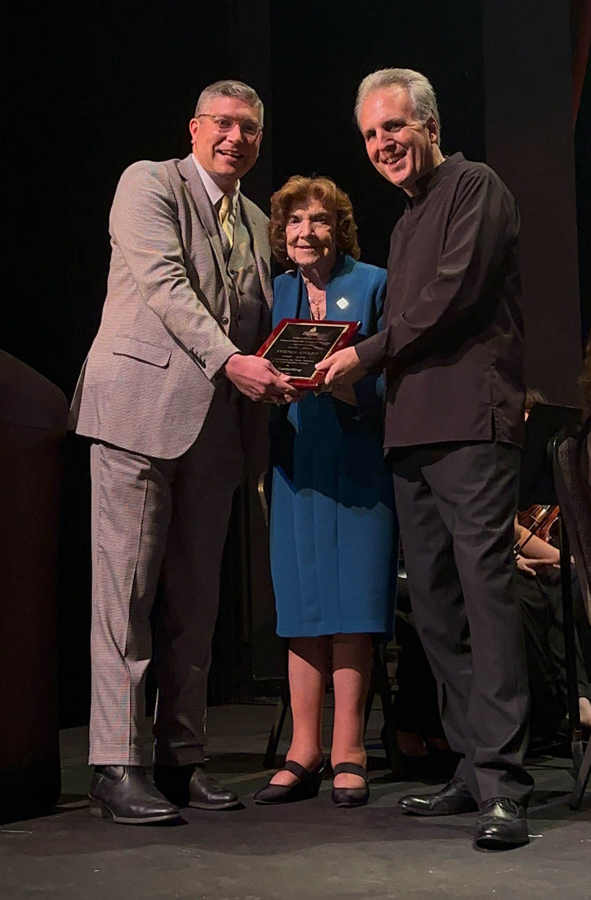 Iris Easterling is presented with the Themis Award at the Symphony’s season finale concert.