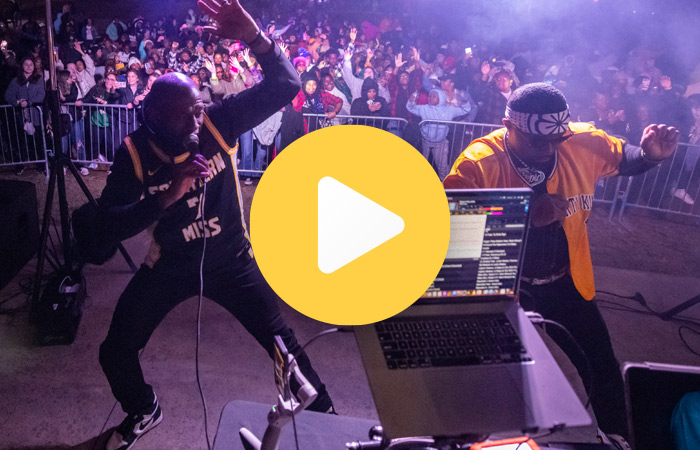 students on stage dancing - play video